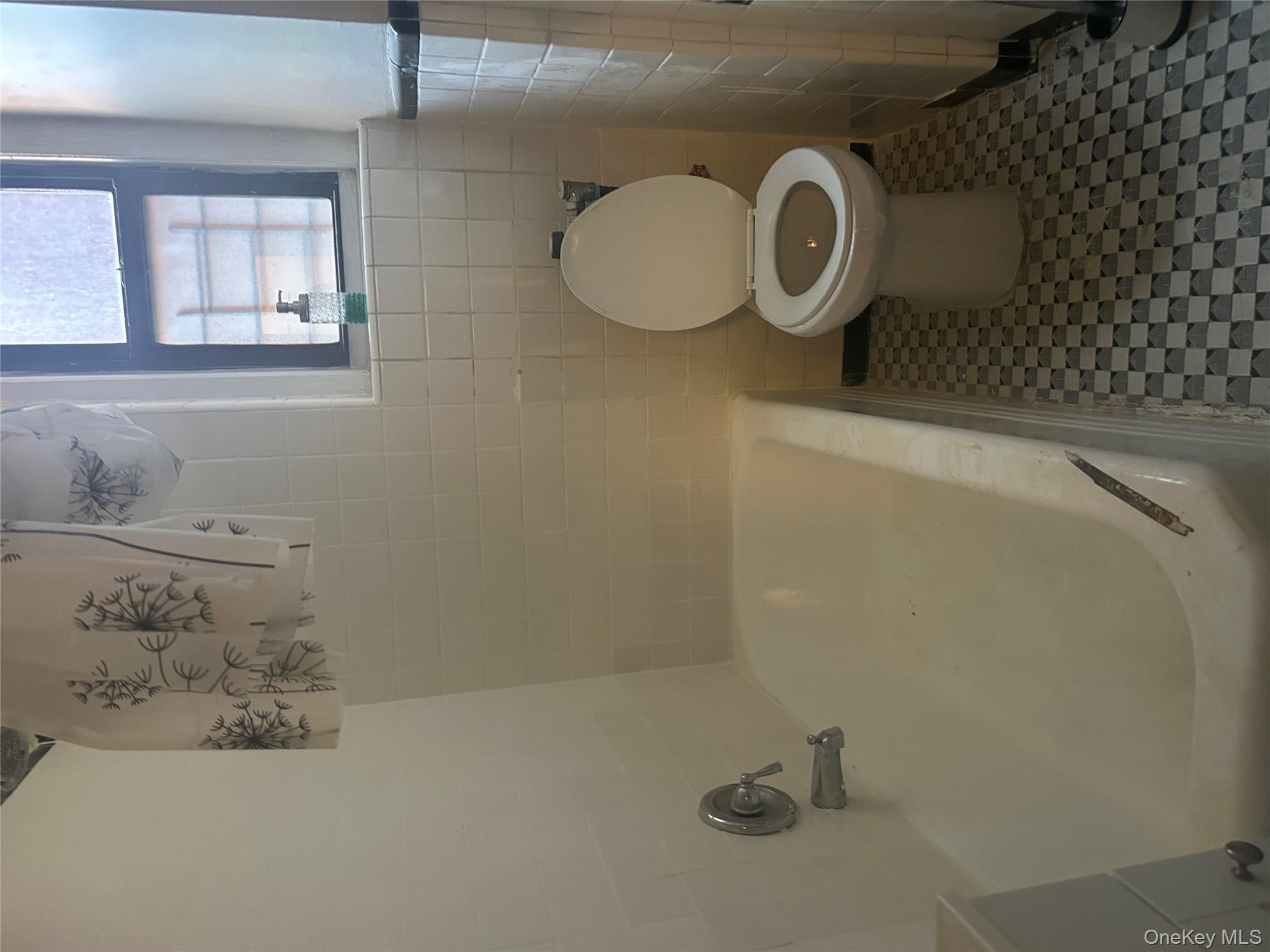 15501 90th Avenue, Unit 3M Queens, NY 11432 - Photo 5 of 6 a bathroom with a toilet and a shower