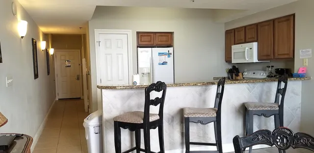a dining room with furniture window and wooden floor