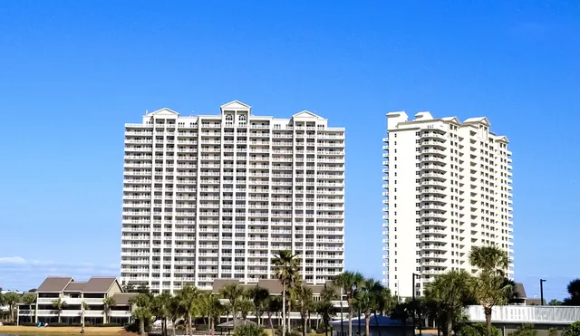 a kitchen with kitchen island granite countertop a table and chairs in it