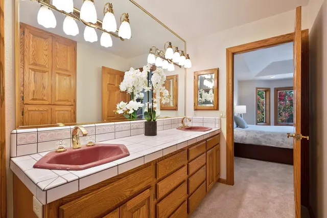 a bathroom with a shower and mirror