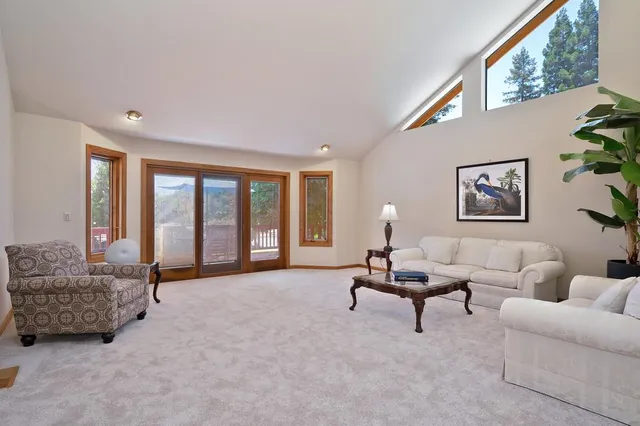 a dining room with furniture a window and wooden floor