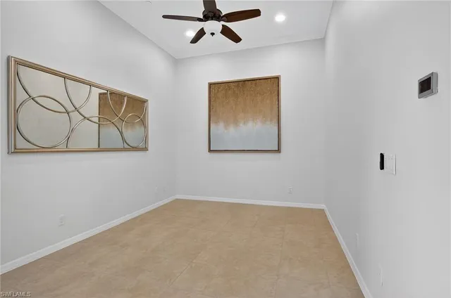 a view of kitchen with kitchen island and stainless steel appliances