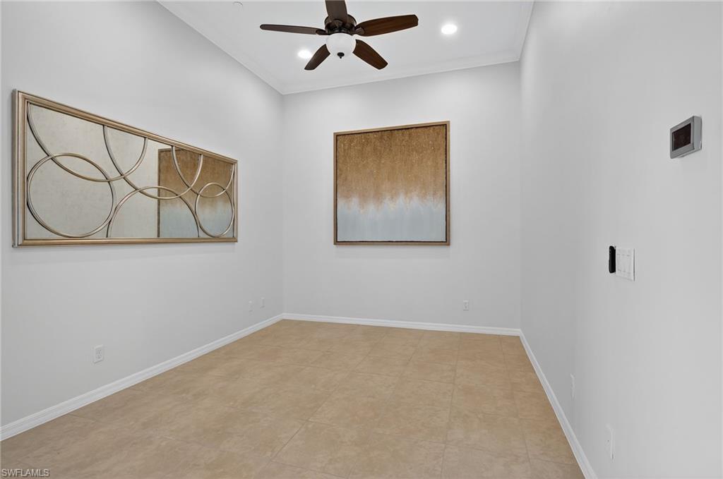 9386 Pocida Court, Unit 202 Naples, FL 34119 - Photo 15 of 38 Empty room featuring ceiling fan, crown molding, and recessed lighting
