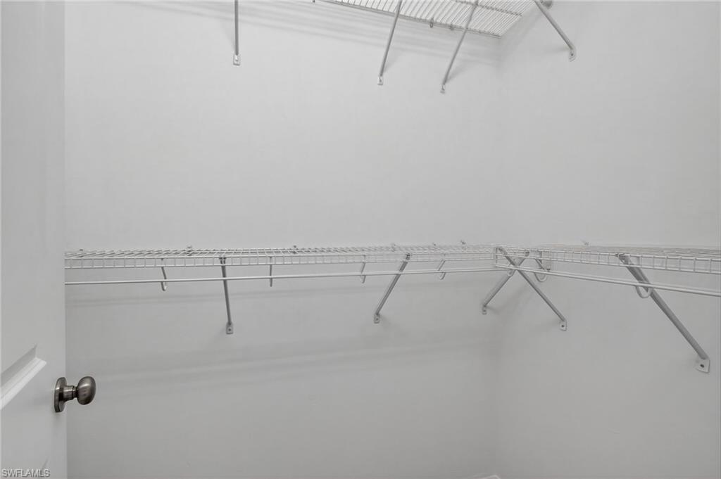 9386 Pocida Court, Unit 202 Naples, FL 34119 - Photo 29 of 38 View of spacious closet