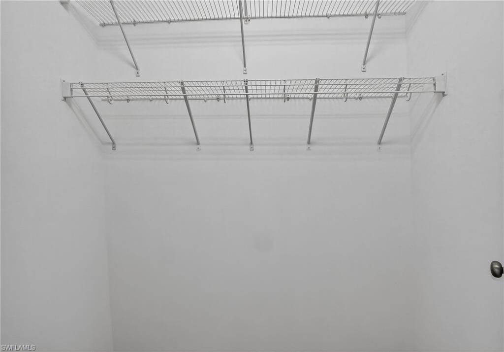 9386 Pocida Court, Unit 202 Naples, FL 34119 - Photo 30 of 38 View of walk in closet