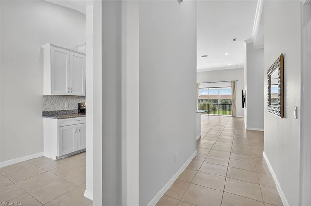 a view of a kitchen with electric appliances