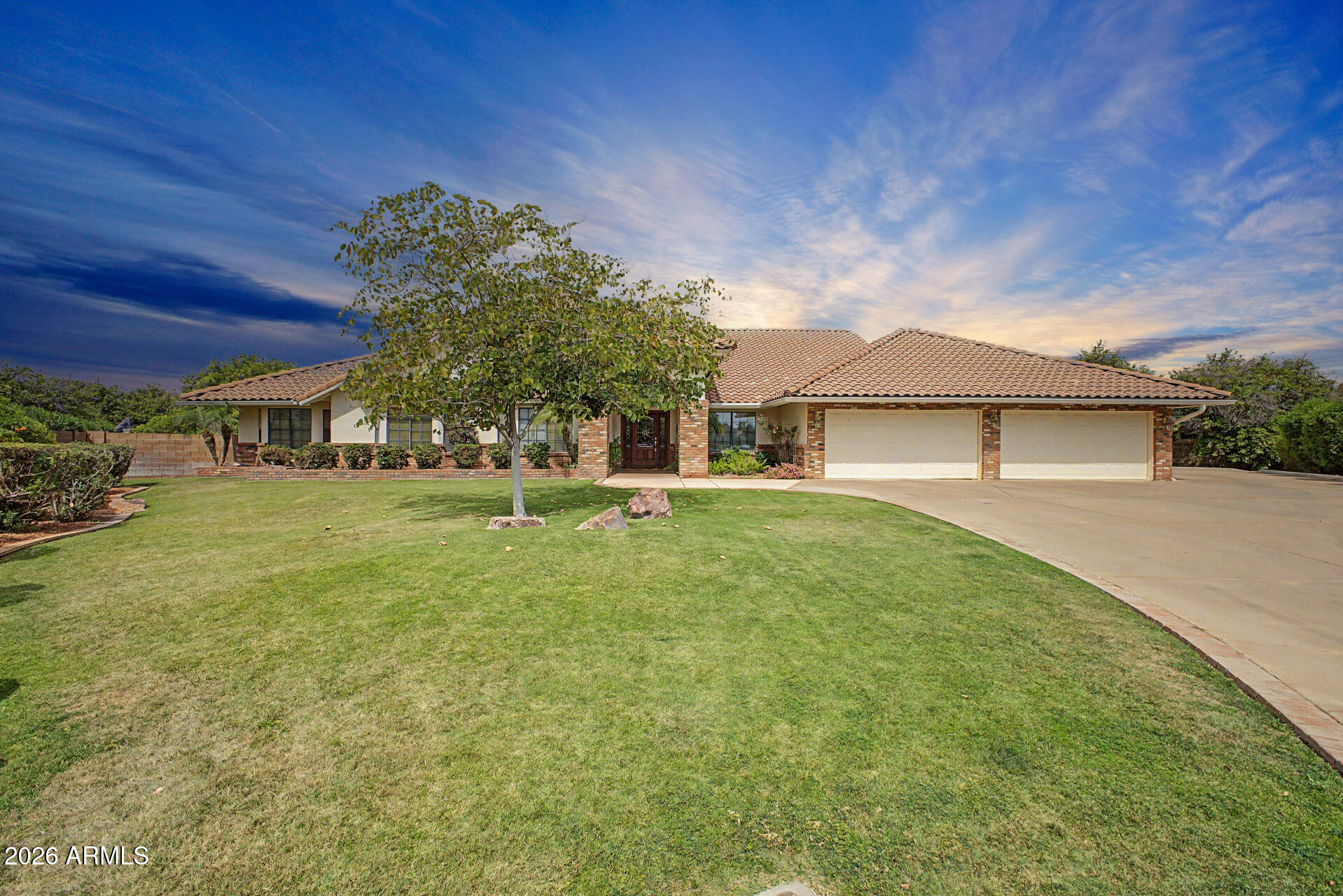 3302 East Draper Circle Mesa, AZ 85213 - Photo 3 of 42 a front view of a house with a yard