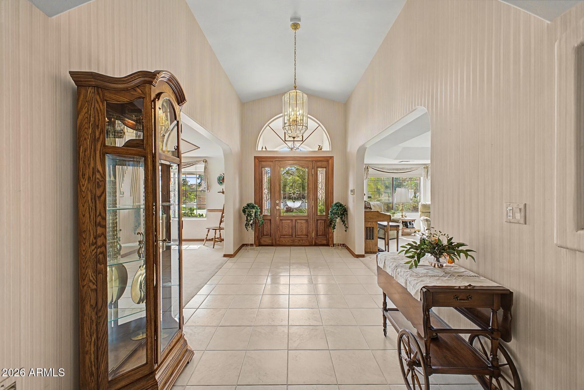 3302 East Draper Circle Mesa, AZ 85213 - Photo 5 of 42 a very nice looking room with a chandelier