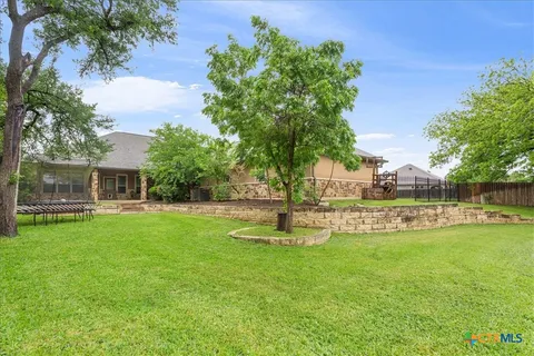 a view of backyard with green space