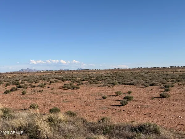 a view of a mountain with sunset