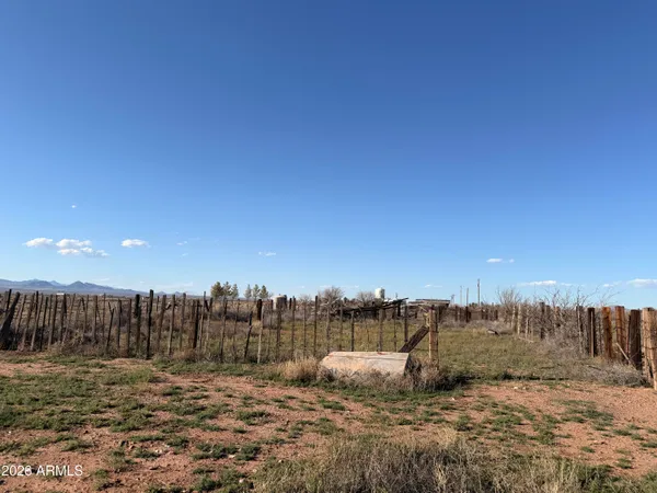 an outdoor view of a house with a ocean view