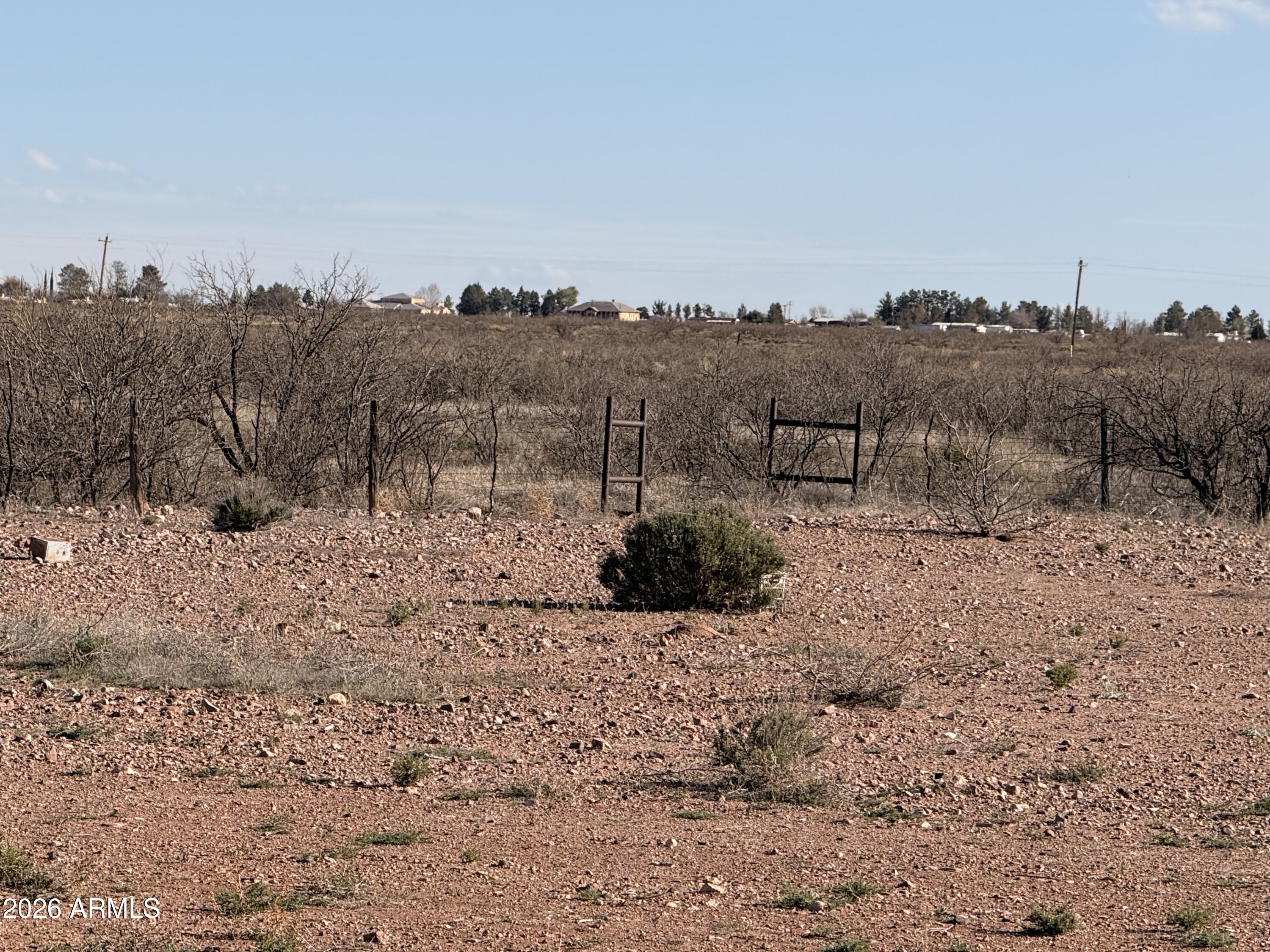 9398 North Hansen Road McNeal, AZ 85617 - Photo 18 of 26 a view of a dry yard with wooden fence