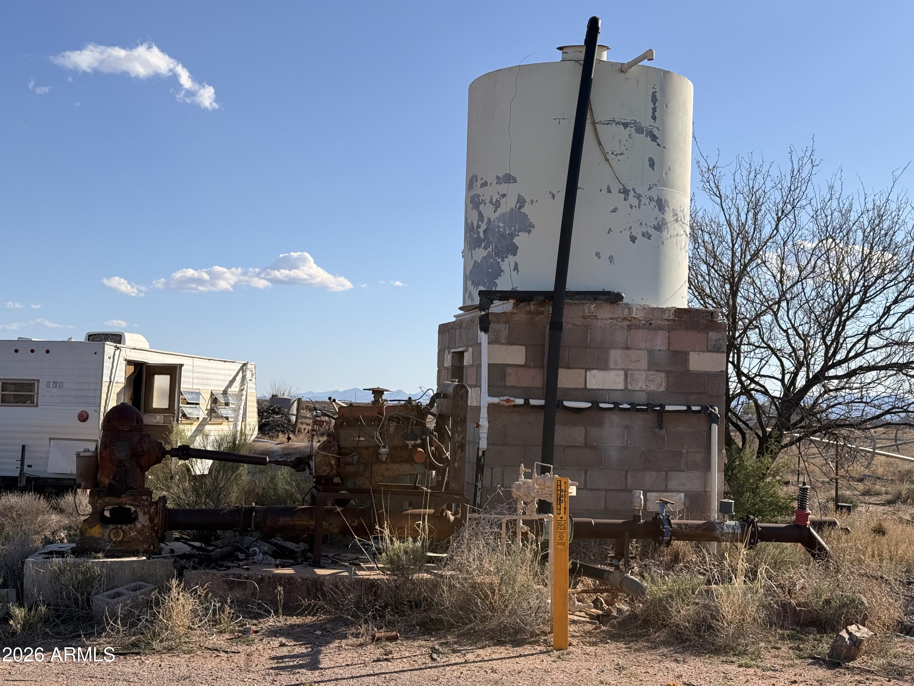 9398 North Hansen Road McNeal, AZ 85617 - Photo 24 of 26 a front view of a house with garden