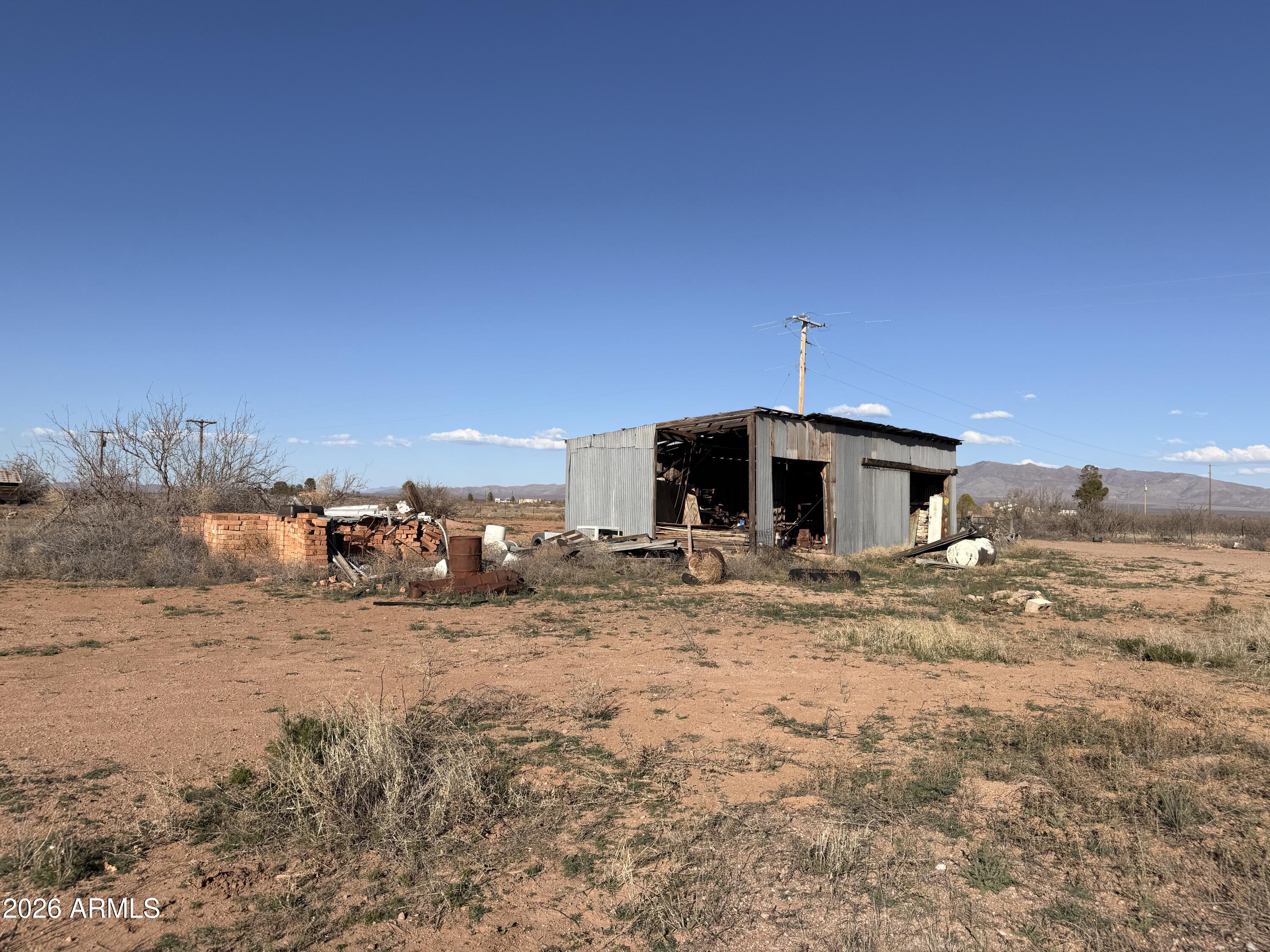 9398 North Hansen Road McNeal, AZ 85617 - Photo 7 of 26 a view of a dry yard with a stove