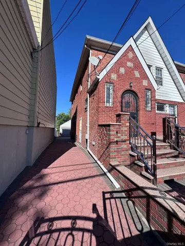 a front view of a house with wooden stairs