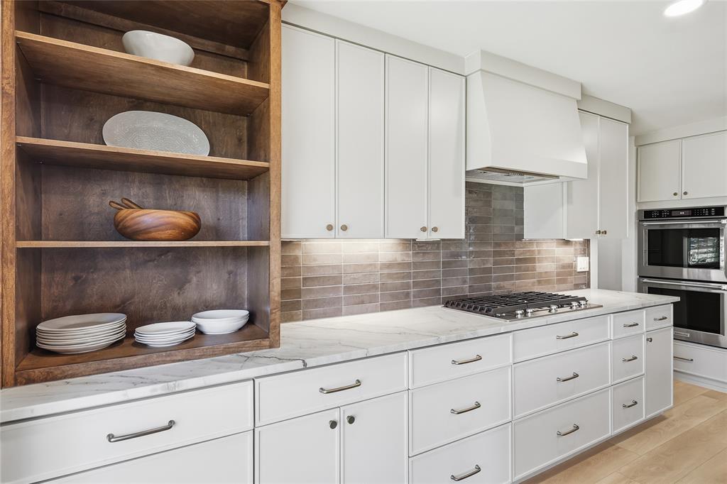 3611 High Drive Grapevine, TX 76051 - Photo 11 of 40 a kitchen with white cabinets and appliances