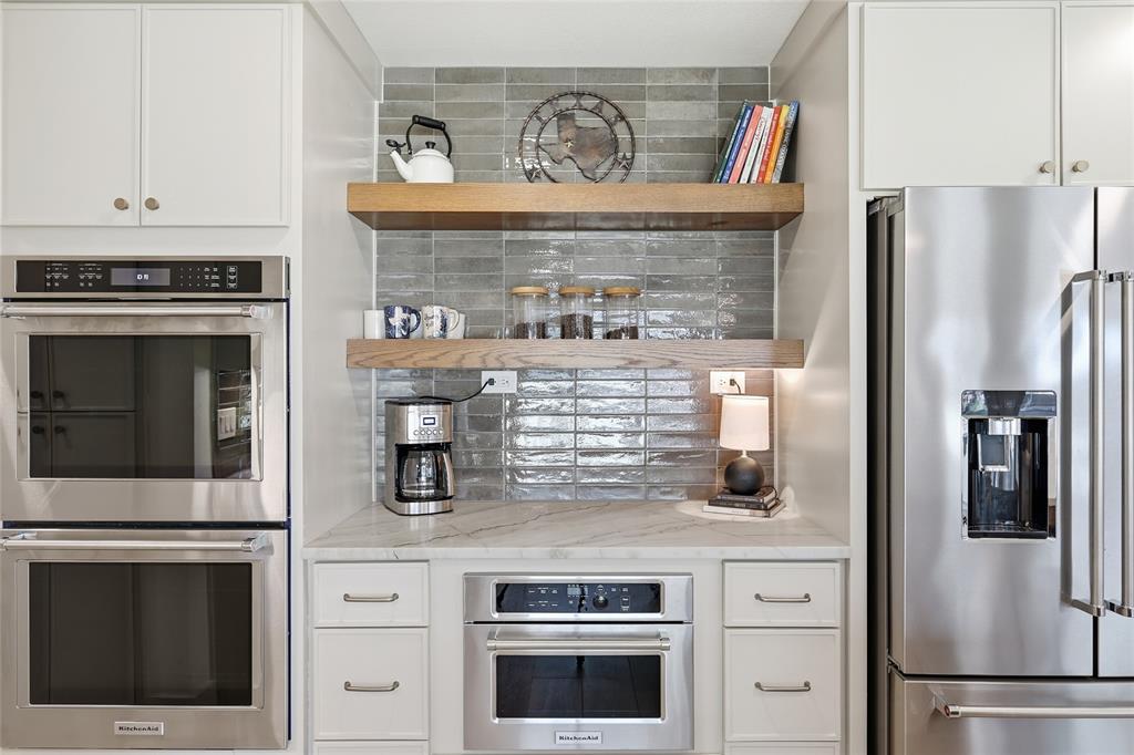 3611 High Drive Grapevine, TX 76051 - Photo 13 of 40 a kitchen with granite countertop a refrigerator stove and oven
