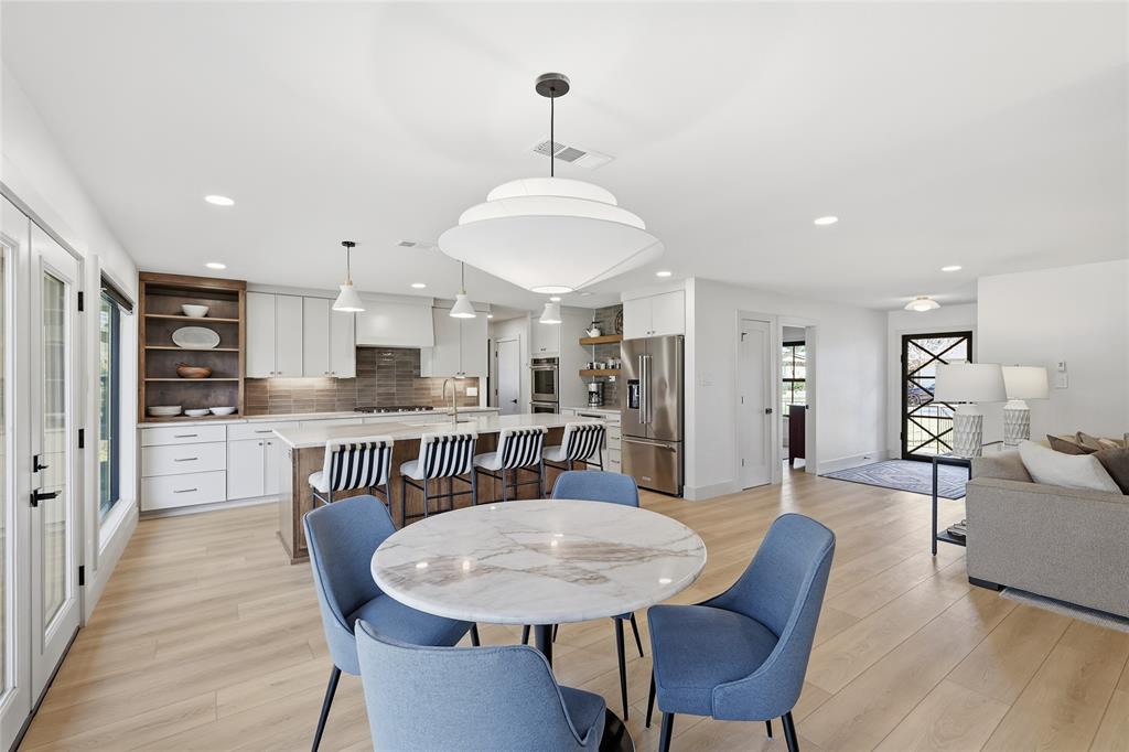 3611 High Drive Grapevine, TX 76051 - Photo 15 of 40 a view of a dining room with furniture and wooden floor