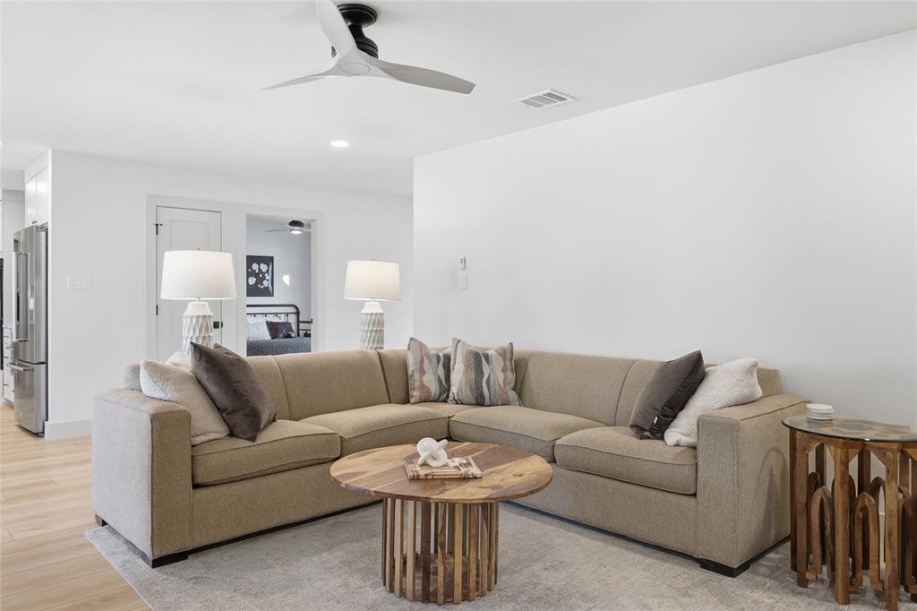 3611 High Drive Grapevine, TX 76051 - Photo 20 of 40 a living room with furniture a rug and a chandelier