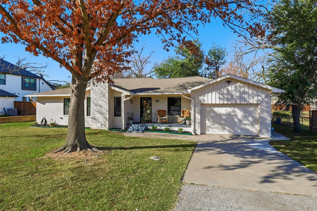 3611 High Drive Grapevine, TX 76051 - Photo 2 of 40 a front view of a house with garden