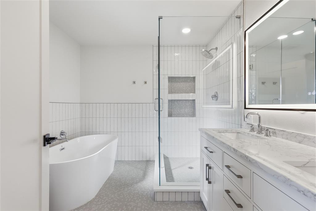 3611 High Drive Grapevine, TX 76051 - Photo 23 of 40 a bathroom with a tub sink shower and mirror