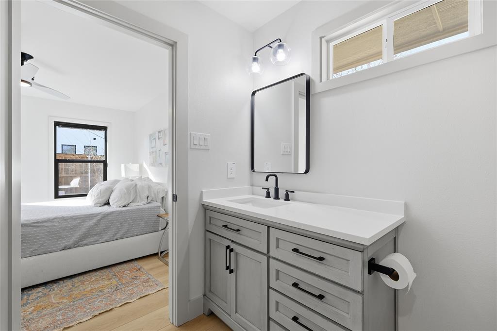 3611 High Drive Grapevine, TX 76051 - Photo 26 of 40 a en suite bathroom with a sink and a mirror