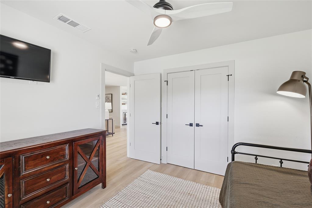 3611 High Drive Grapevine, TX 76051 - Photo 29 of 40 a spacious bedroom with a bed and a flat tv screen on dresser