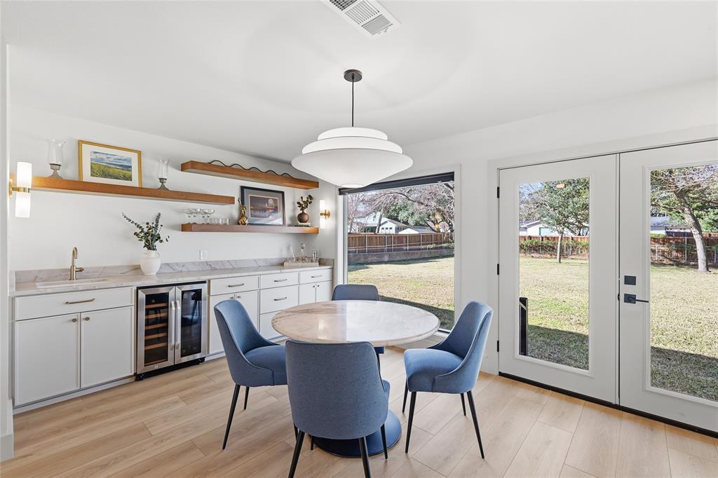 3611 High Drive Grapevine, TX 76051 - Photo 4 of 40 a dining room with furniture a chandelier and wooden floor