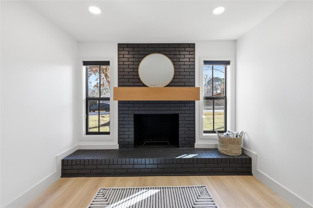 3611 High Drive Grapevine, TX 76051 - Photo 7 of 40 a living room with furniture a rug and a fireplace
