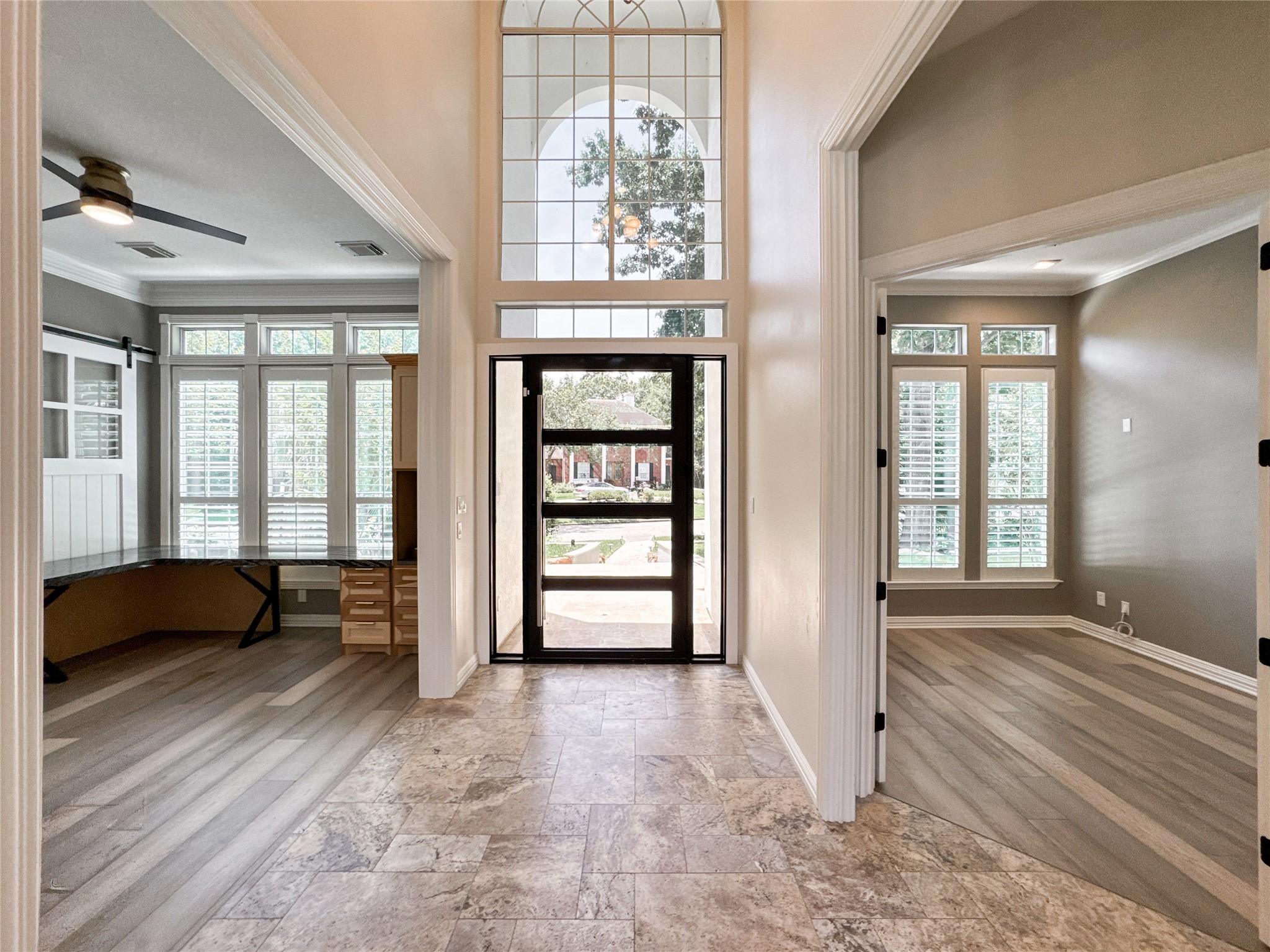 1810 Woerner Road Houston, TX 77090 - Photo 6 of 39 Step into elegance through this stunning entryway, featuring high ceilings, abundant natural light, and a view that sets the tone for the entire home.