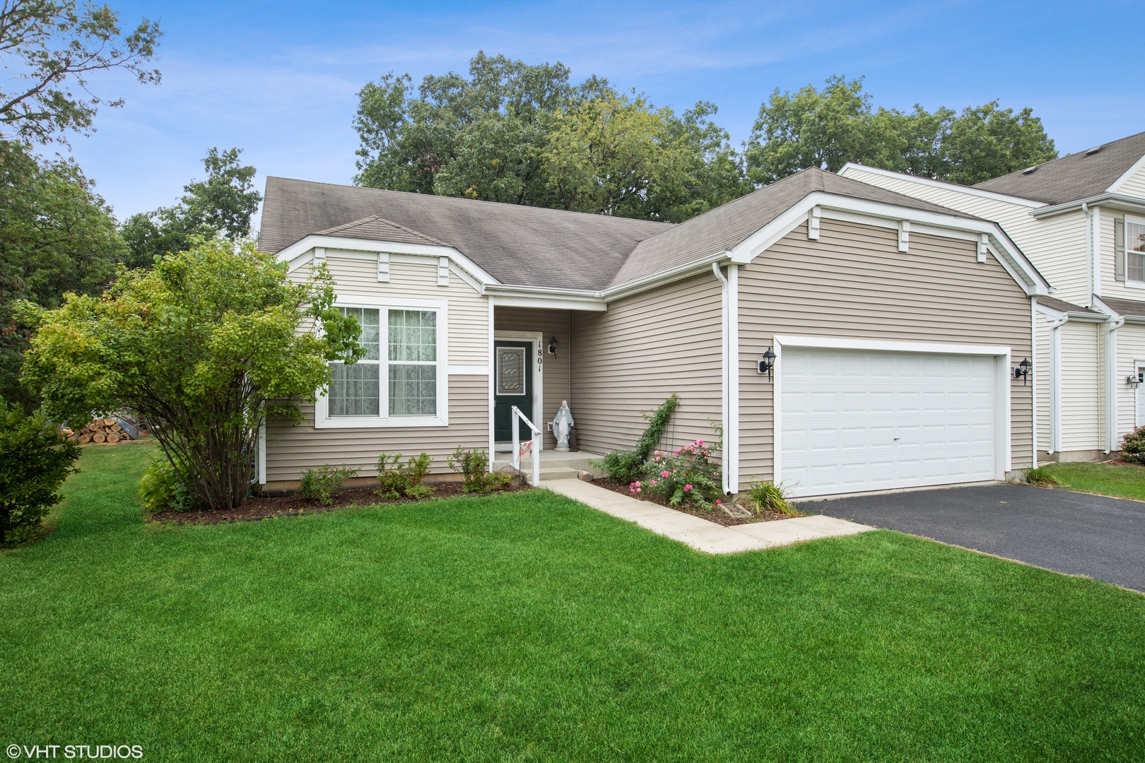 1801 Butterfield Road Woodstock, IL 60098 - Photo 1 of 19 a view of a house with a yard and sitting area