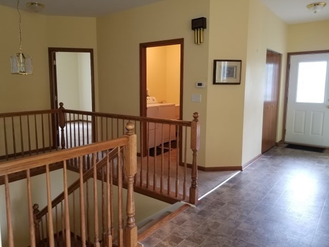 1801 Butterfield Road Woodstock, IL 60098 - Photo 15 of 19 a view of hallway with livingroom