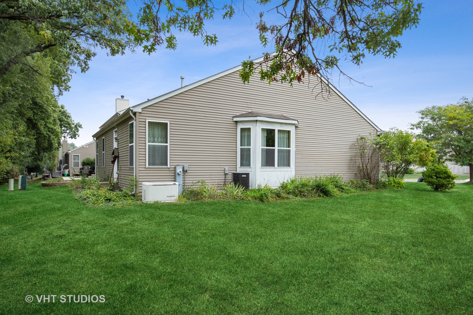 1801 Butterfield Road Woodstock, IL 60098 - Photo 2 of 19 a view of a house with a yard