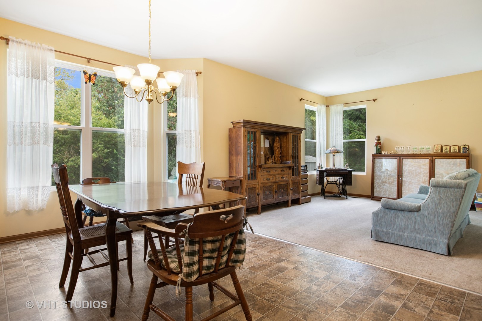 1801 Butterfield Road Woodstock, IL 60098 - Photo 4 of 19 a view of a livingroom with furniture and window