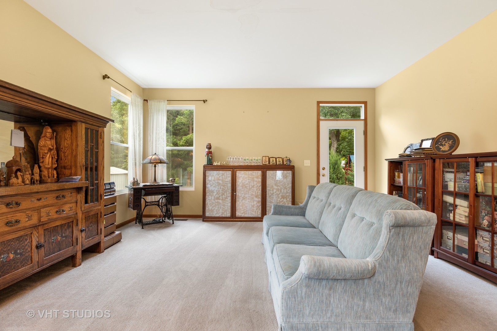 1801 Butterfield Road Woodstock, IL 60098 - Photo 5 of 19 a living room with furniture and large windows