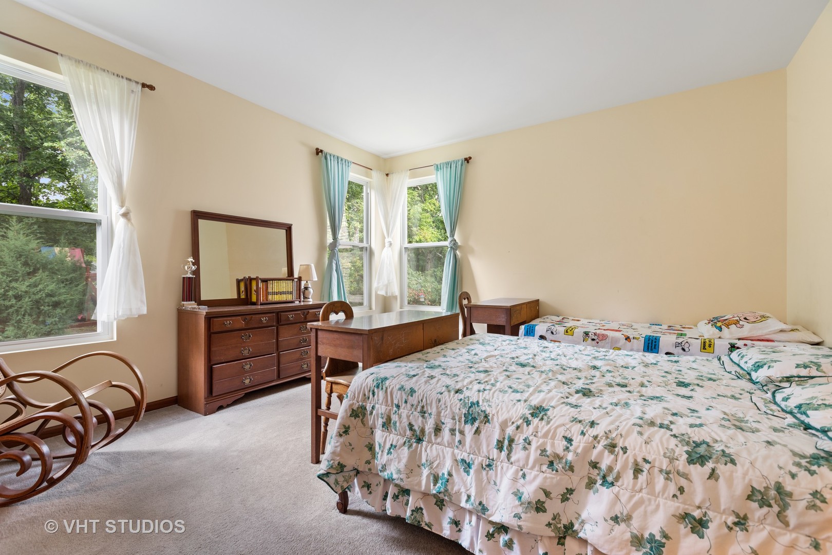 1801 Butterfield Road Woodstock, IL 60098 - Photo 8 of 19 a bedroom with a bed and a window