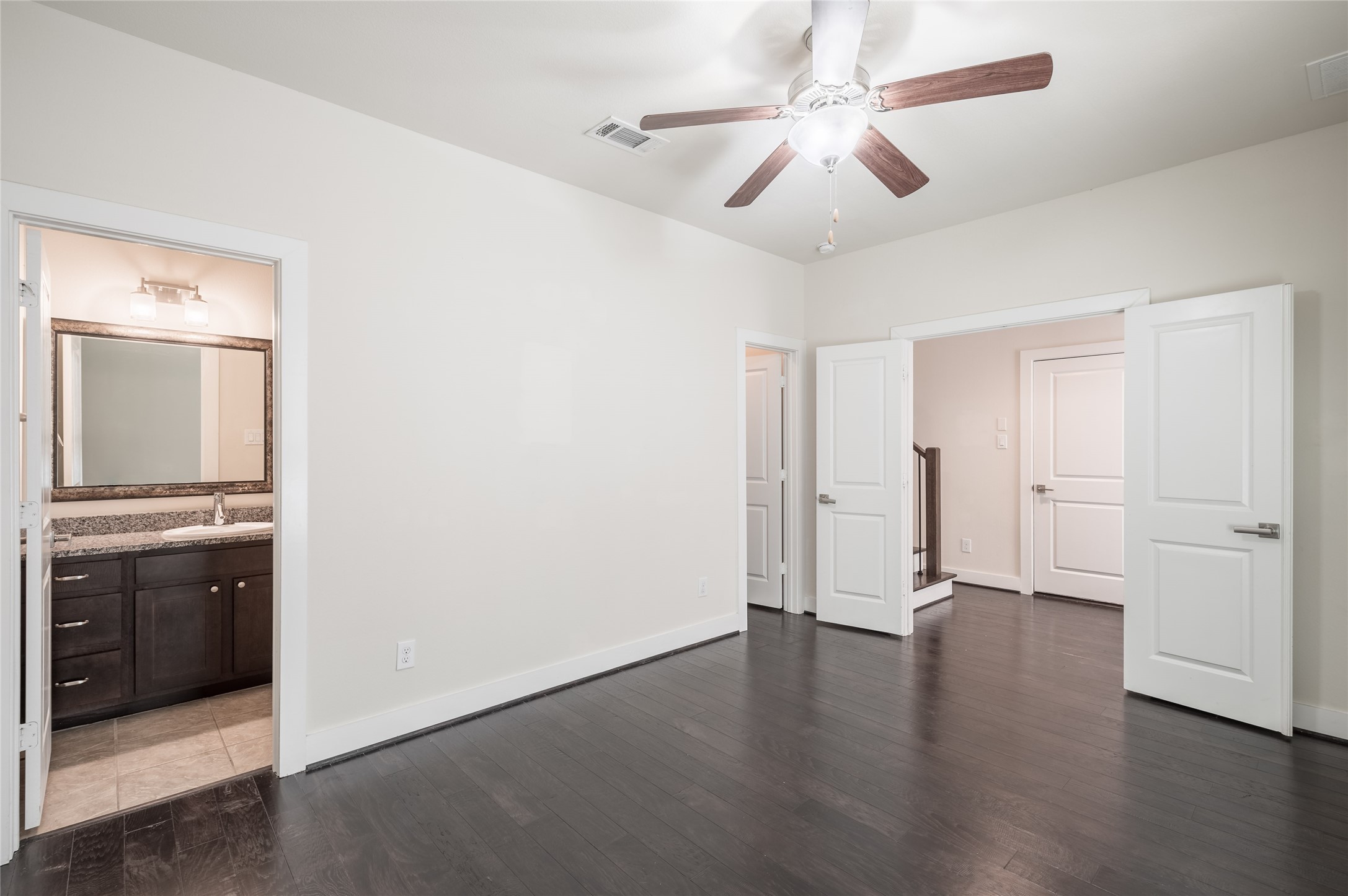 4408 Eli Street, Unit A Houston, TX 77007 - Photo 12 of 22 an empty room with wooden floor and ceiling fan