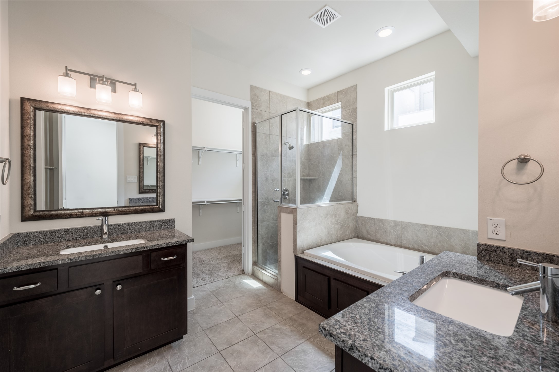 4408 Eli Street, Unit A Houston, TX 77007 - Photo 13 of 22 a bathroom with a double vanity sink and a mirror