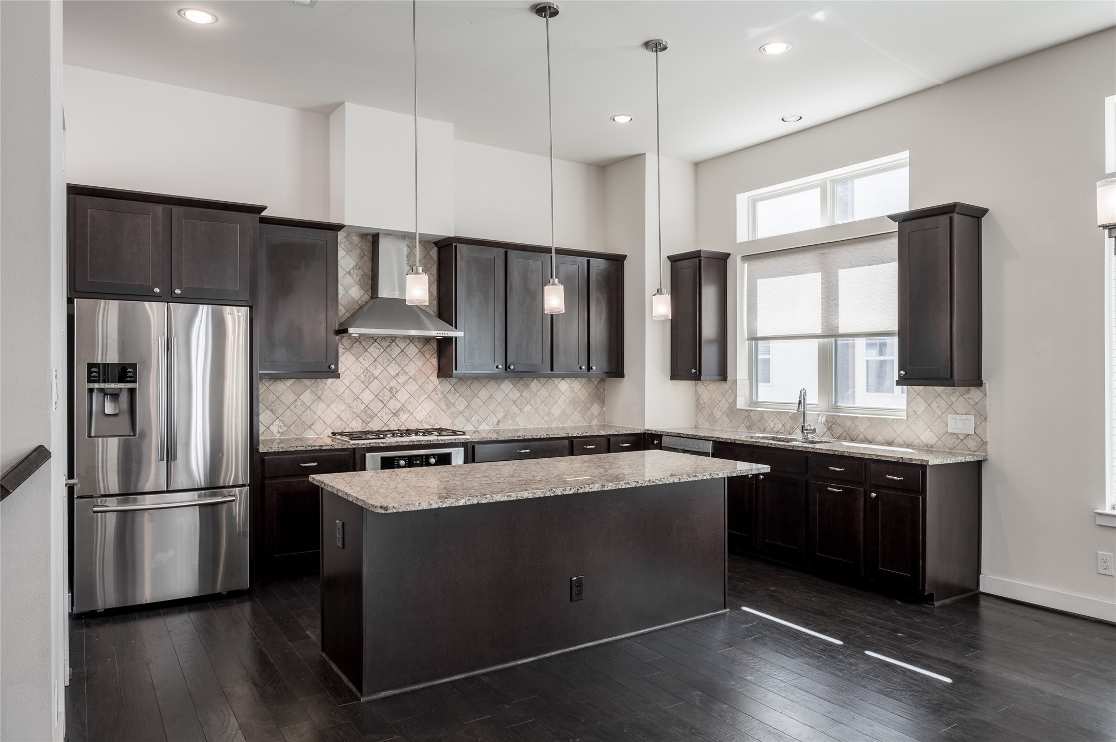 4408 Eli Street, Unit A Houston, TX 77007 - Photo 5 of 22 a kitchen with stainless steel appliances granite countertop a sink stove and refrigerator