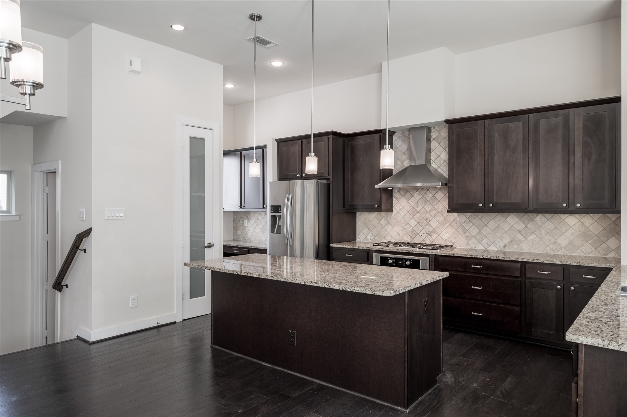 4408 Eli Street, Unit A Houston, TX 77007 - Photo 6 of 22 a kitchen with stainless steel appliances granite countertop a sink stove and refrigerator