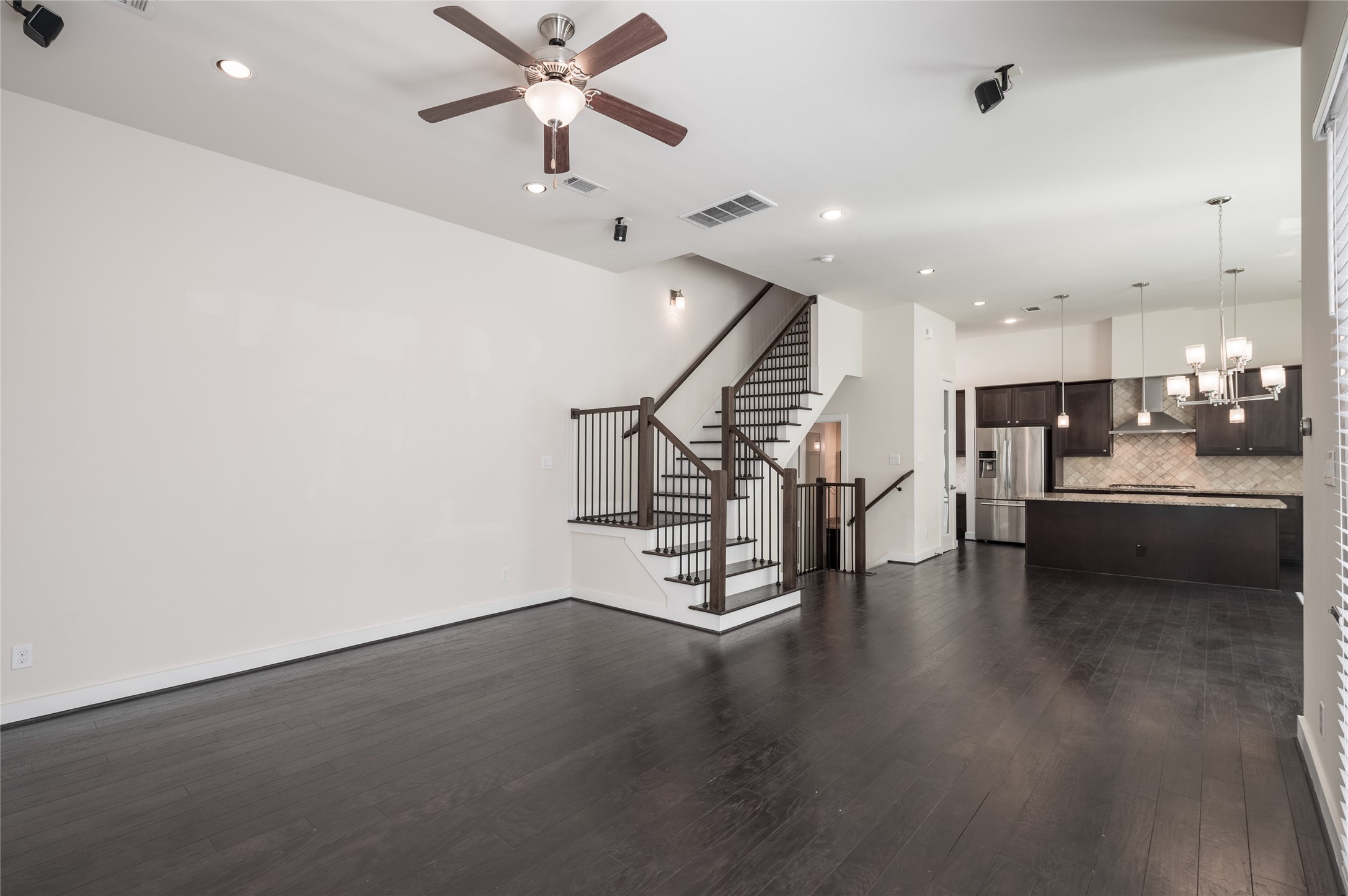 4408 Eli Street, Unit A Houston, TX 77007 - Photo 9 of 22 a view of empty room with wooden floor and stairs