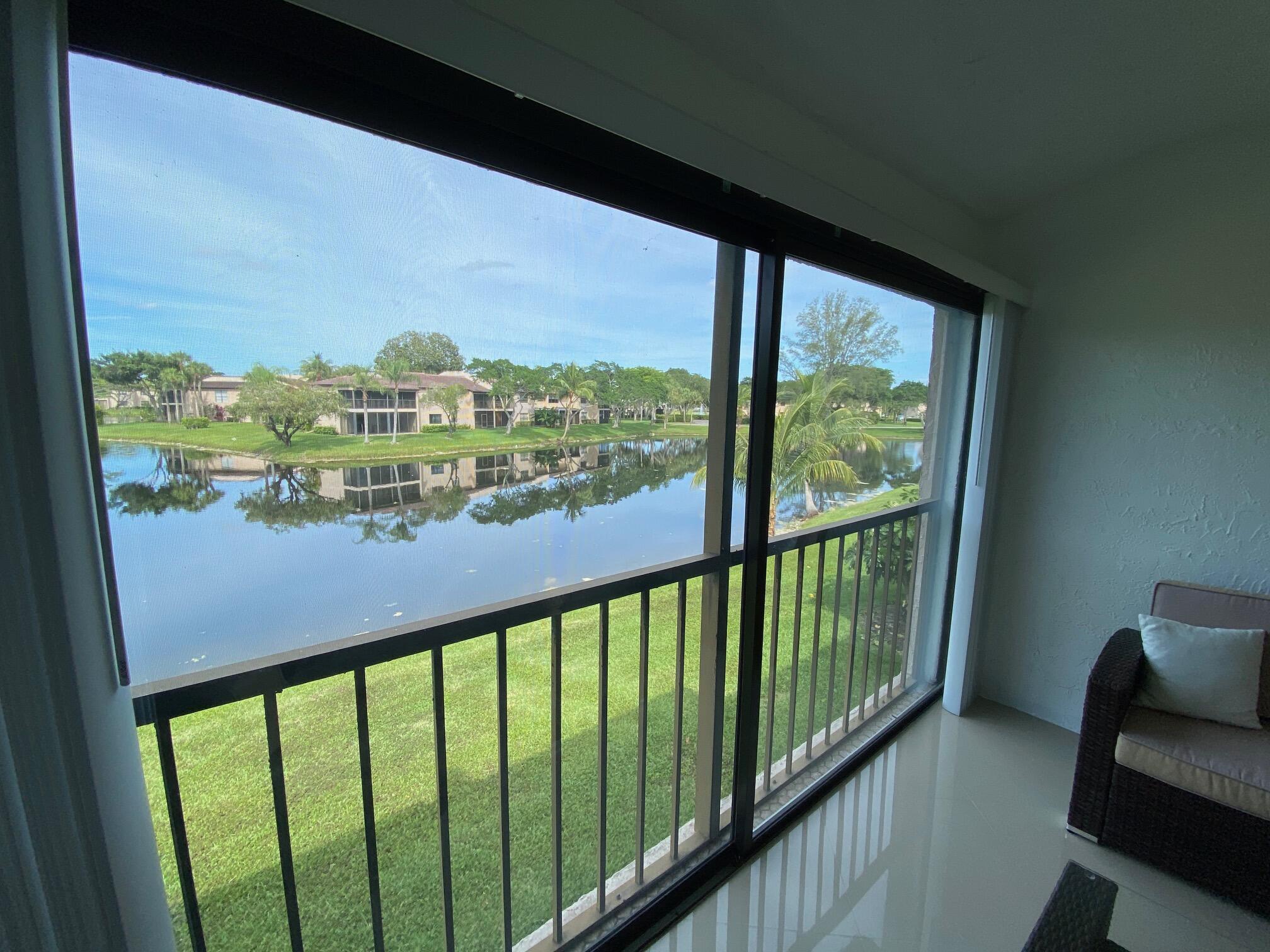 9285 Vista Del Lago, Unit 36F Boca Raton, FL 33428 - Photo 11 of 24 a view of a balcony with furniture