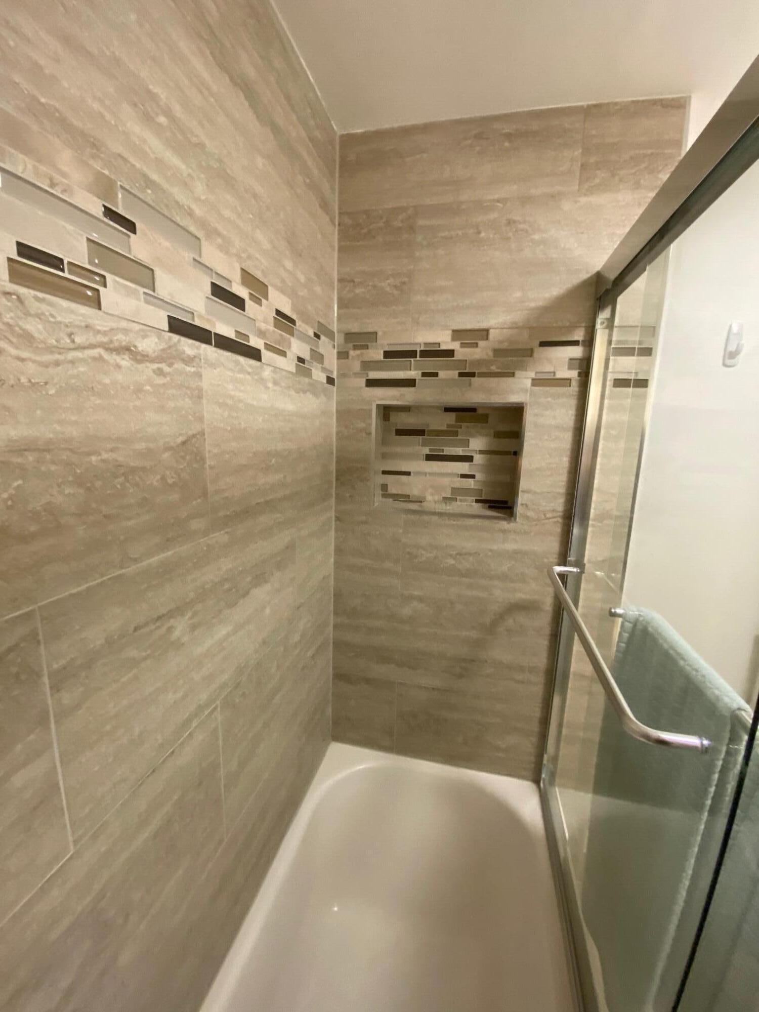 9285 Vista Del Lago, Unit 36F Boca Raton, FL 33428 - Photo 15 of 24 a bathroom with a shower