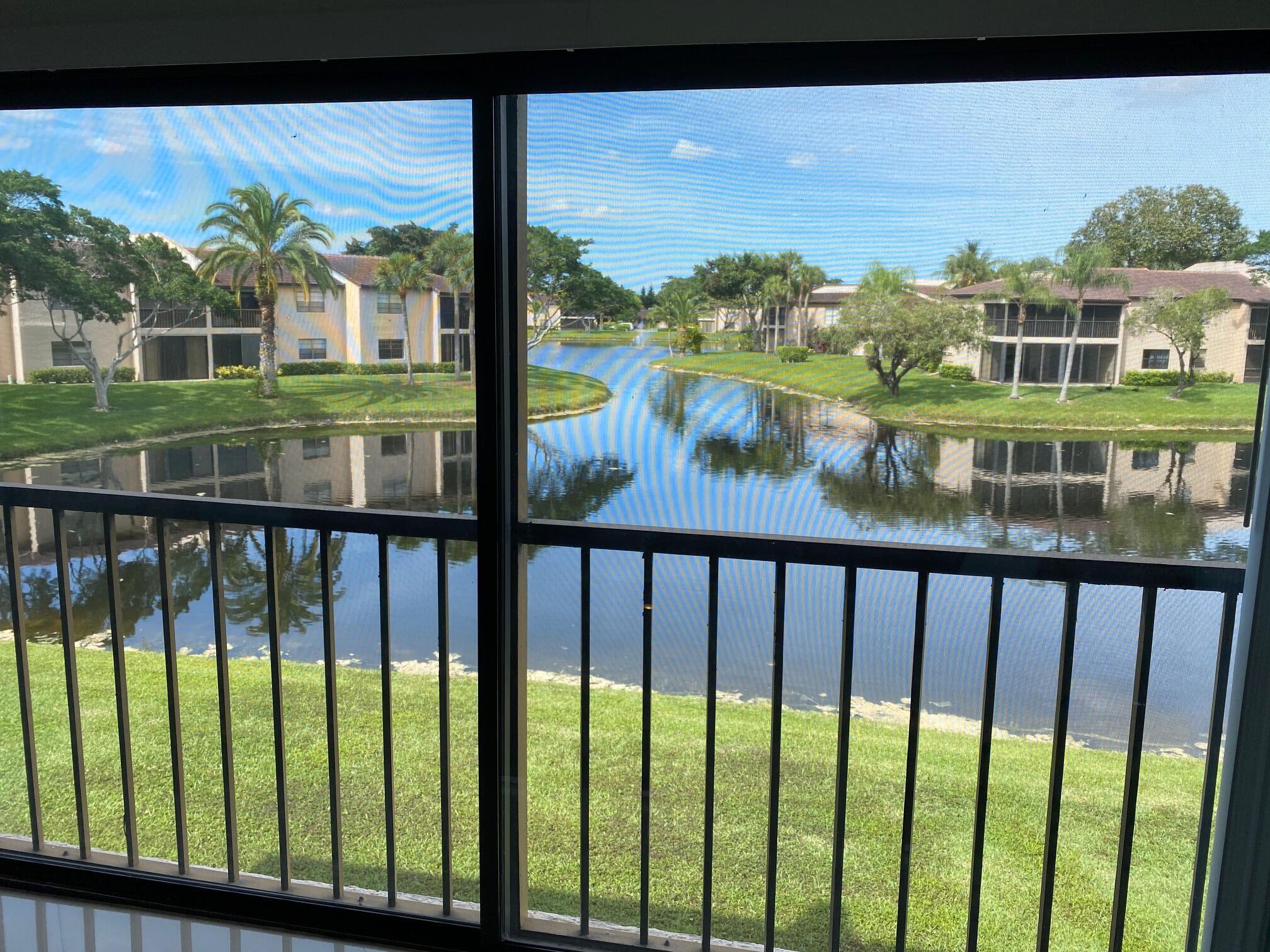 9285 Vista Del Lago, Unit 36F Boca Raton, FL 33428 - Photo 20 of 24 a view of lake from balcony