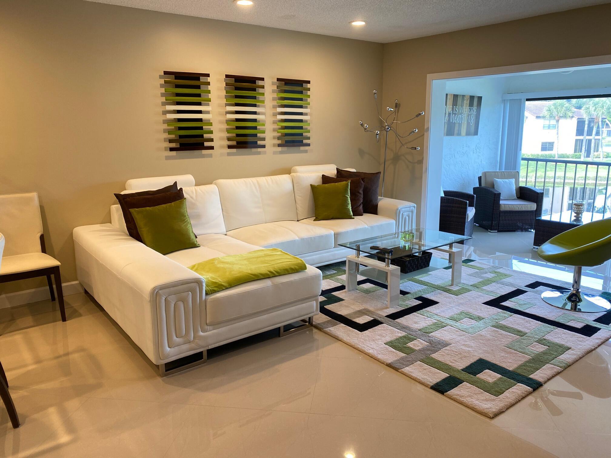 9285 Vista Del Lago, Unit 36F Boca Raton, FL 33428 - Photo 4 of 24 a living room with furniture
