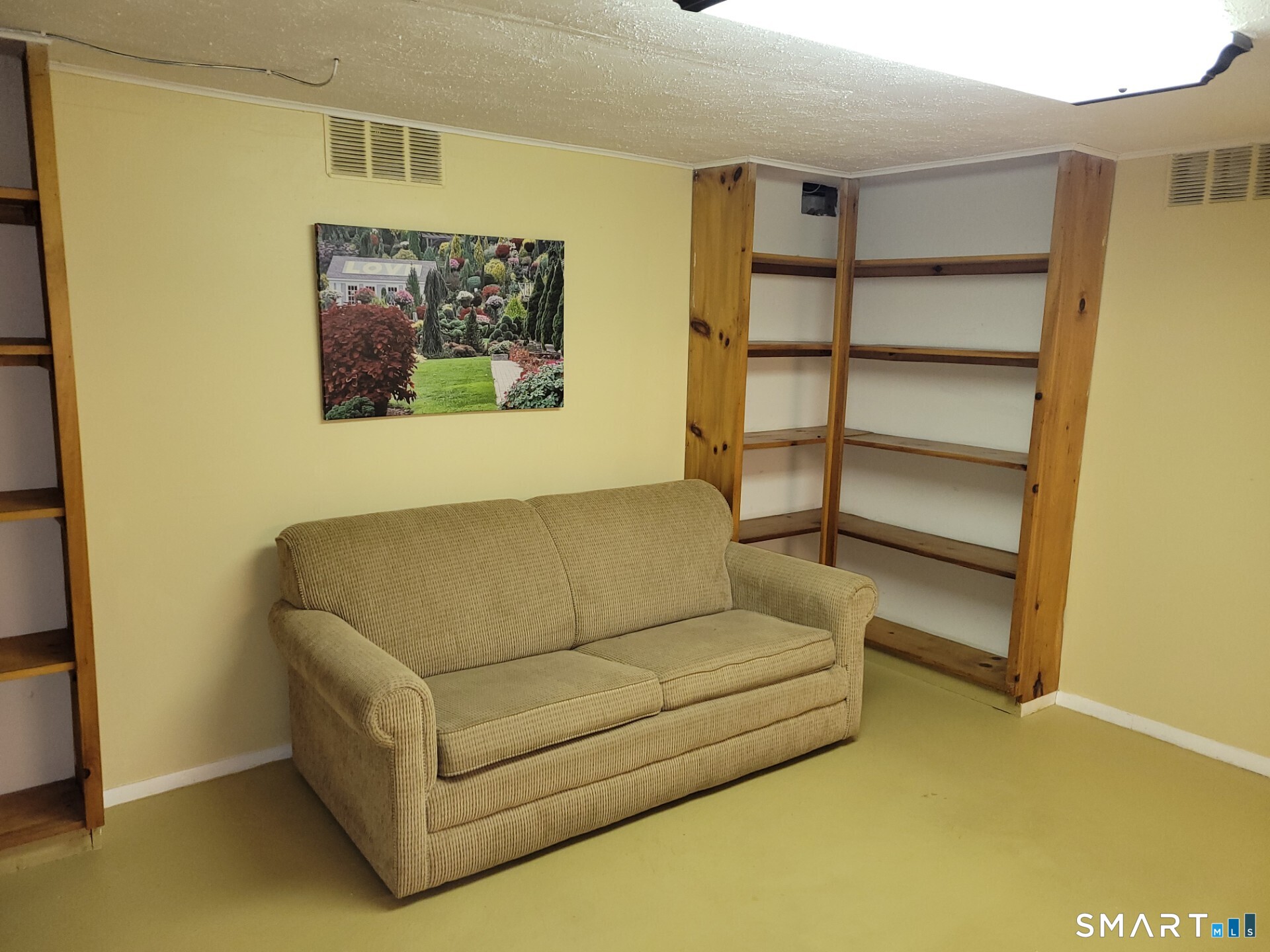 41 East Granby Road Granby, CT 06035 - Photo 14 of 61 a living room with a couch and a bookshelf