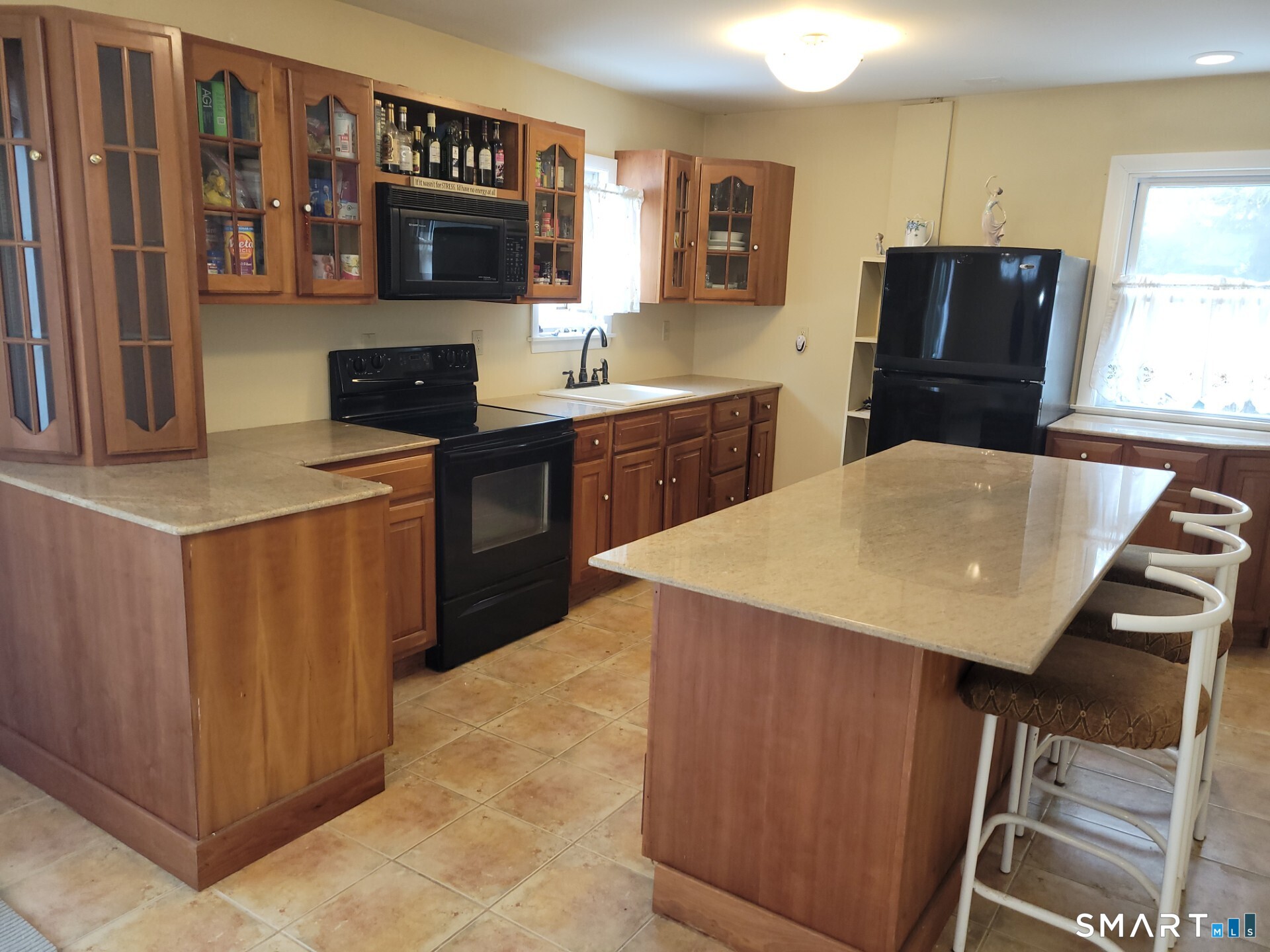 41 East Granby Road Granby, CT 06035 - Photo 17 of 61 a kitchen with stainless steel appliances kitchen island a refrigerator sink and microwave