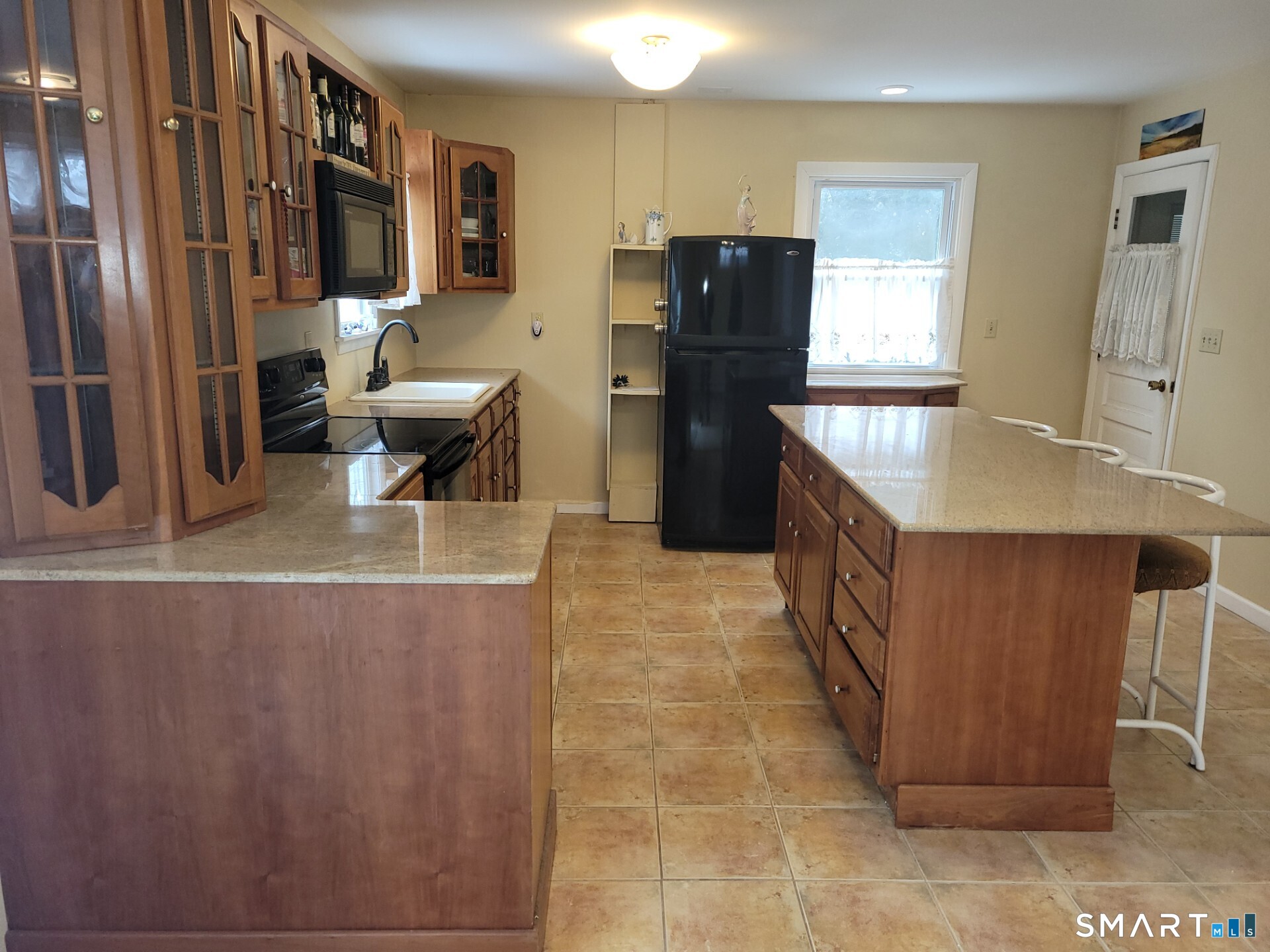 41 East Granby Road Granby, CT 06035 - Photo 18 of 61 a kitchen with stainless steel appliances granite countertop a refrigerator a stove and a sink