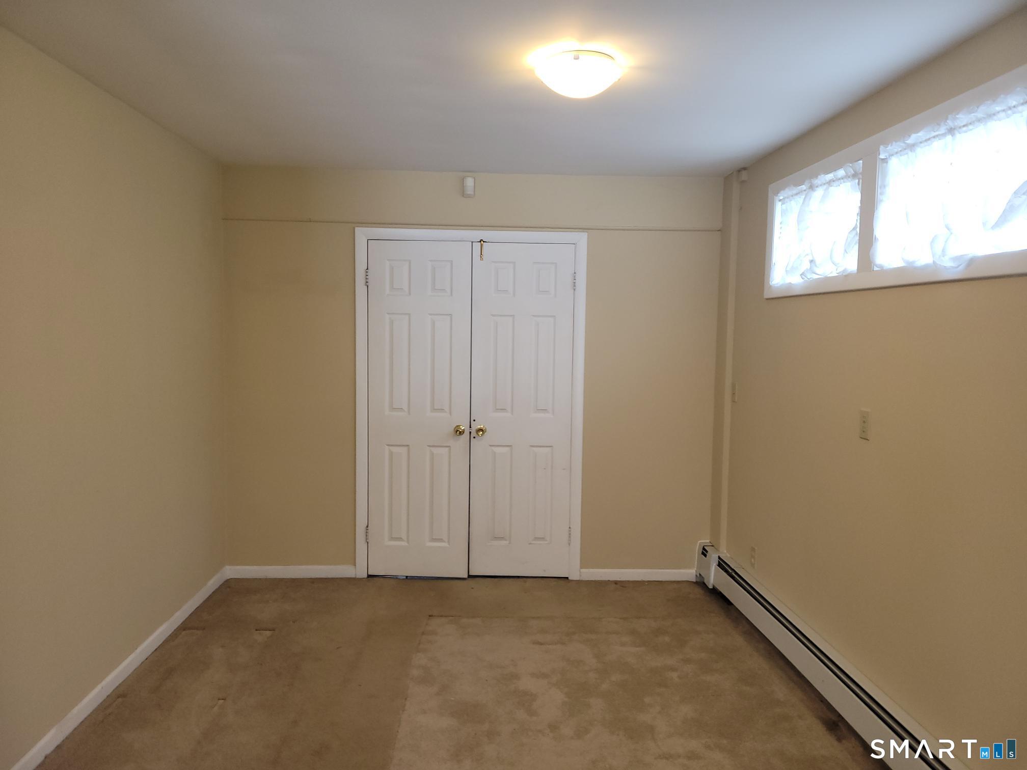 41 East Granby Road Granby, CT 06035 - Photo 28 of 61 an empty room with windows