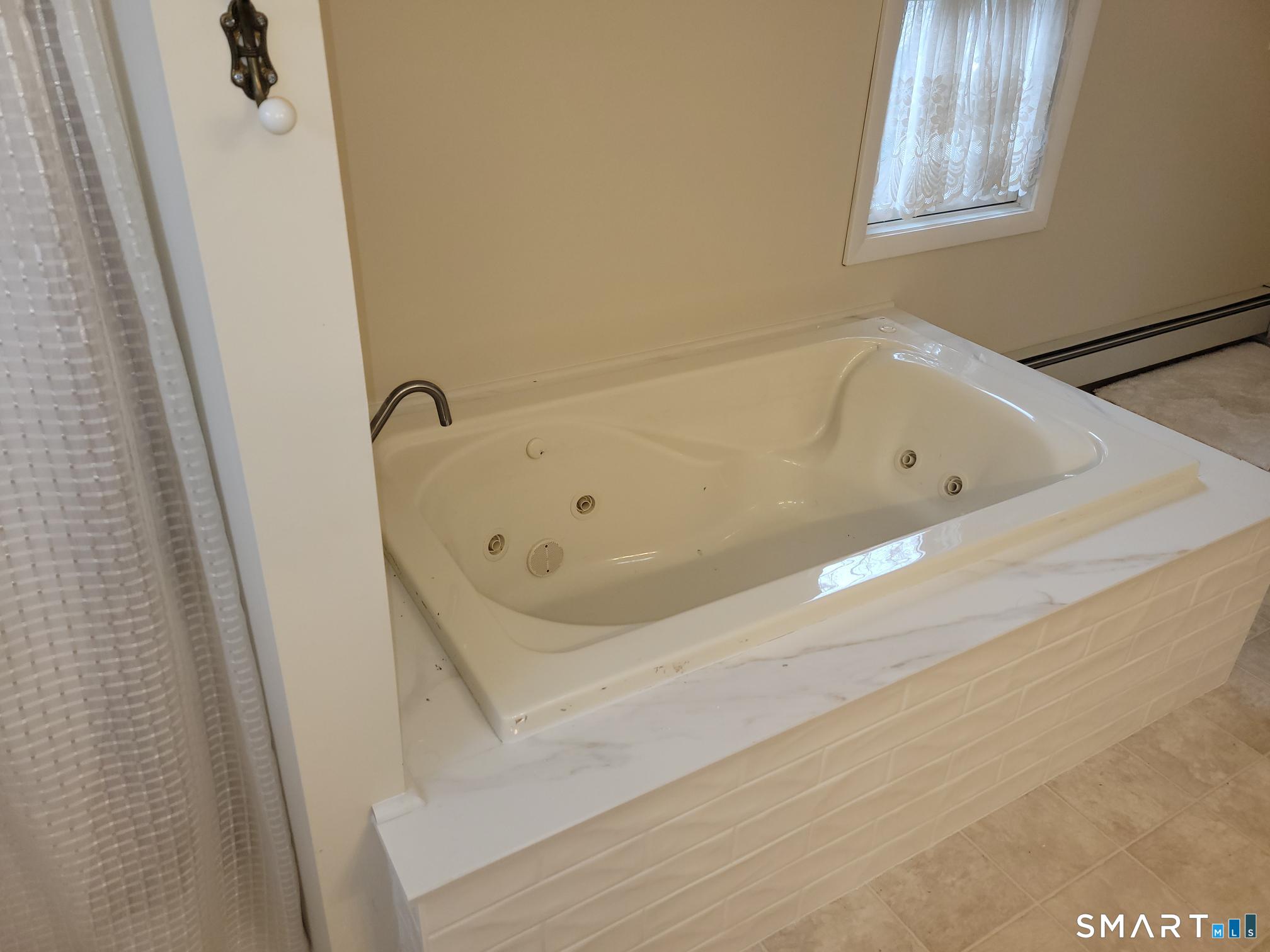 41 East Granby Road Granby, CT 06035 - Photo 29 of 61 a bathroom with a bathtub